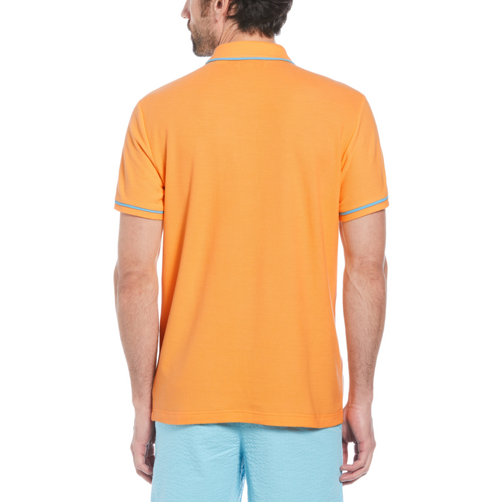 Polo earl orgánico piqué pegatina Pete naranja con ribete azul