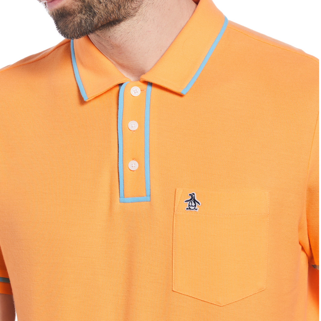 Polo earl orgánico piqué pegatina Pete naranja con ribete azul