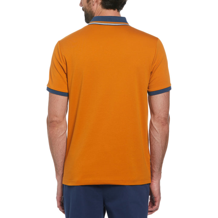 Polo Interlock bowling stripe naranja